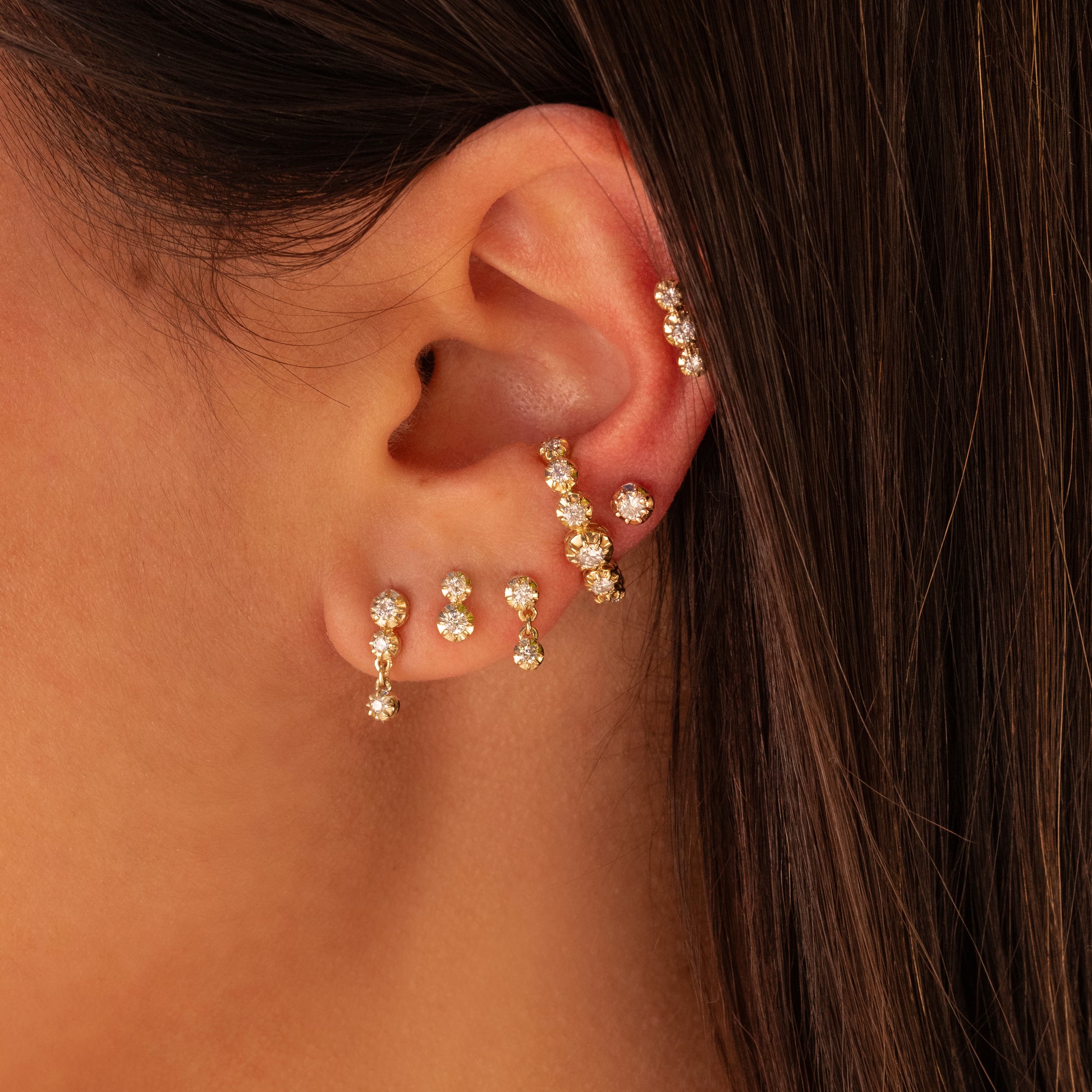 SMALL 2 GRADUATED ROUND SOPHIA DIAMOND STUD ON MODEL